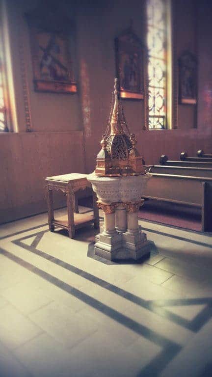 The beautiful baptismal font was taken out of hiding and installed in the back. Note the new floor which replaced the old carpet. This will eventually cover the entire church floor.