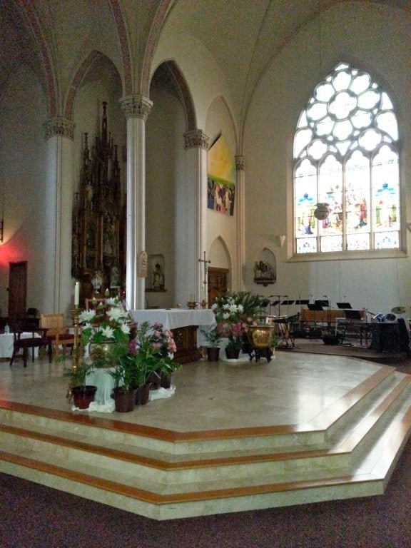 Saint Michael Parish in Milwaukee. Altar rail removed and sacred space of sanctuary blurred by obtrusive "stage."